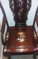 Antique Indonesian solid carved rosewood arm chair decorated with mother of pearl inlay;. Made of rosewood and...