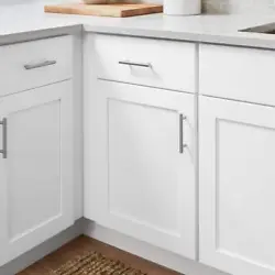 Make use of narrow spaces between appliances or storage units with this slim Hampton Bay Avondale shaker alpine base...