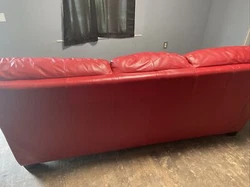Red Leather Sofa. Condition is Used. Shipped with USPS Ground Advantage.