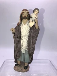 Santon en terre cuite et tissus imprégné non signé.Très beau et très fin travail.Santonnier à...