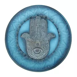 A highly detailed incense burner in soothing shades of dark blue and aqua. It features a Hamsa hand with an eye,...