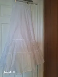 Add some volume and fluff to your wedding or formal attire with this crinoline petticoat skirt. The white polyester...