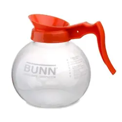 The BUNN 42401.0101 12-Cup Glass Coffee Decanter with its orange handle is designed for continuous use, serving coffee...
