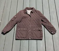 100% polyester filling. This jacket is well-loved (see pictures); the price reflects this. Nonetheless, it is a classic...