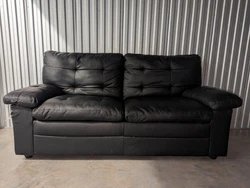 Used Black Leather couch. Reliable and comfortable to people and animals. My cats will testify to that by their love...