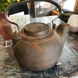VINTAGE CAST IRON TEA POT WATER KETTLE HUMIDIFIER WITH SWIVEL LID. Obviously needs some cleaning..old world solid.....