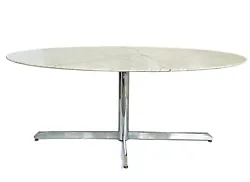 This Roche Bobois stainless steel marble dining table is in the Florence Knoll Style. The oval table is supported by a...