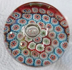This is a beautiful Murano Millefiori paperweight that is approx 3