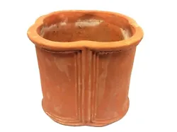 The planter shows wear including a chip to the top edge, discoloration, and signs of use.