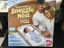 Supreme Snuggle Nest by Baby Delight. It comes with a removable 2 1/2” incline wedge, side air vents, foam mattress...