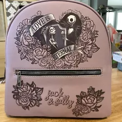 This mini backpack is a must-have for any fan of The Nightmare Before Christmas. Featuring Jack and Sally in a romantic...