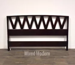 A mid century modern full size headboard designed by Paul Frankl for Johnson Furniture in a dark mahogany or ebony...