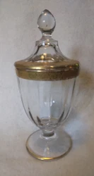 This beautiful clear glass apothecary style candy dish stands almost 9 inches tall.  The gold decoration is missing or...