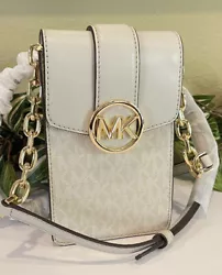 Crossbody strap with Chain Accent. Gorgeous MK Signature in Light Sa nd. MK Charm Logo adorns Front. Interior has MK...