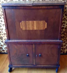 Antique Wood Liquor Cabinet/Bar. A beautiful antique liquor cabinet in good condition. On wheels. All original (I...