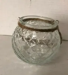 Hanging Clear Glass Circular Bowl. There is a hole at the bottom.