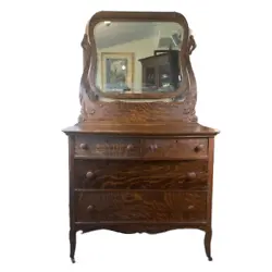 This Antique Oak 4 Drawer Bowed Front Dresser with Beveled Mirror is a stunning piece with beautiful grain. The dresser...