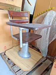 This old lecture hall school chair with writing desk arm is mounted on a piece of counter top. Could be remounted on...