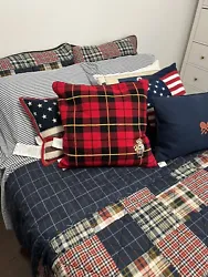 The red tartan plaid design featuring an embroidered sled bear will bring a cozy and inviting feel to any room. Made...