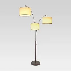 • Modern floor lamp with 3 lights • Metal construction keeps it sturdy • Linen shades bring a softness to the...