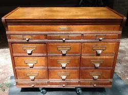 Antique Yawman and Erbe oak file cabinet section with 15 drawers built around 1900. Also the back is laminated and has...