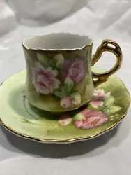 This beautiful cup and saucer set from Lefton China features hand-painted floral roses and scalloped gold edges. The...