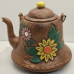 This vintage teapot style  cookie jar is in nice condition with no chips or cracks. The maybe a couple of areas with...