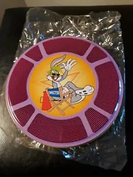 Warner Brothers  collectible  tin with Bugs Bunny  sitting in the Directors Chair. New.