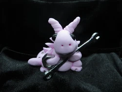 This dragon knows how to use that wrench. They are made for mature children to adults. They are semi fragile and are to...