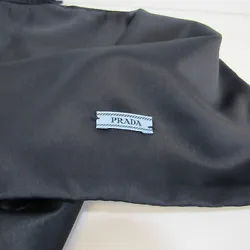 Elegant dark midnight blue satin dust bag by PRADA. Has blue woven drawstring closure. Logo label near bottom of bag.