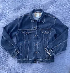 The jacket features a solid blue color and is made of 100% cotton material. It is machine washable and has a denim...