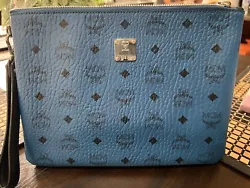 NWOT Comes with COAThis MCM clutch bag is a versatile and stylish accessory for any woman. Made of genuine leather in a...