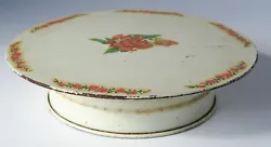 Cake Stand Plate. To wind it turn the top clockwise. w/ Floral Design.