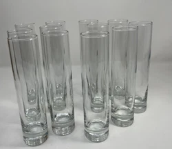 12 modern slender glass vases. 7.5 inches tall and 1.5 inches in diameter. All clear glass with thick glass on the...