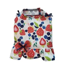 Velcros underbelly and neck for easy on and off. This shirt is made from colorful print fabric with a ruffle. Product...