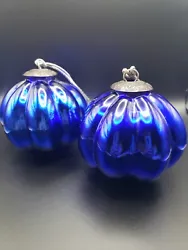 Two vintage blue glass christmas ornaments. Each ornament weights 5.1 oz for a total of 10.2oz  without packaging.
