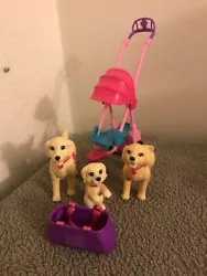 Includes 3 dogs- Mom, Dad, Puppy. Basket and dog stroller. Very good condition. Batteries are not included with...