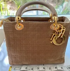 Christian Dior. Lining Color. Bag Height. Product Line. Brown / Nylon. Lining Material. Inside has strain and rubbing....