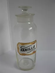 ANTIQUE GLASS PHARMACY APOTHECARY JAR. IT HAS A GLASS LABEL THAT SAYS VANILLA. GROUND GLASS STOPPER. I DONT SEE AND...
