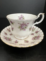 The delicate floral pattern, featuring sweet violets, is sure to impress. Crafted in England, this set is made of...