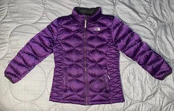 The North Face Winter Jacket.Warm 550 Down filled Purple Jacket.Full zip and zippered pockets.Size XL 18 teenWomen’s...