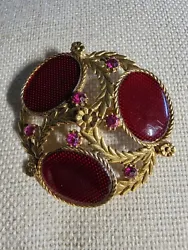 Vintage Gold Tone Brooch With Red Stones And Rhinestones. No obvious markings. Small flaw on edge of gold tone...