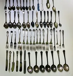 This 58 piece vintage silverplate lot includes a mix of many brands and types of flatware and silverware. The pieces...