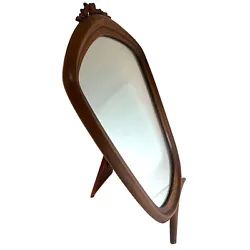 Art Nouveau. Wood Carved Flowers. The mirror is in excellent condition and is sure to add a touch of elegance to any...