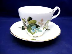 Made of GENUINE BONE CHINA in ENGLAND. The set is decorated with white flowers and green, aqua and peach leaves.The...