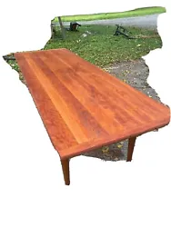8 Foot Cherry Table. This table is in very good condition. It has nice wooden wheels.Measures 72“ x 33“ wide by 30...