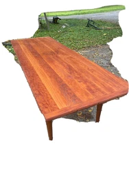 This table is in very good condition. It has nice wooden wheels.