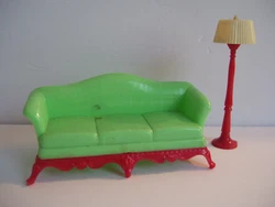 Sofa is Renwal No. 78. Plastic floor lamp is red and has a pleated ivory-colored shade. Both pieces are odor-free and...