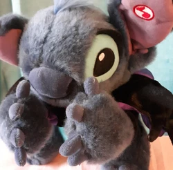 He makes spooky sounds and moves his arms when you press the button on his ear. He has been tested and he does work. He...