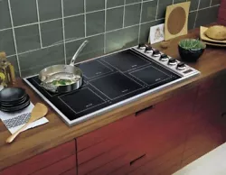 36 inch induction cooktop with MangeQuick Induction Elements and Push-to -turn safety feature. Black glass and knobs. 6...